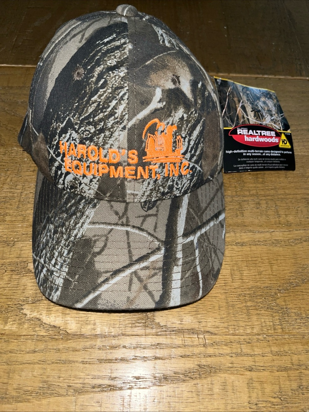 Harold's Equipment Inc. Snapback Trucker Hat Camoflauge Green Brown & Orange